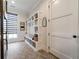 Mudroom featuring built-in shelving, storage, and Herringbone tile flooring at 00 Daxton Dr (Lot 74), Canton, GA 30115