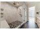 Modern tiled shower features a mosaic tiled floor, built in bench, and glass door at 00 Daxton Dr (Lot 74), Canton, GA 30115