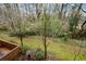Overhead backyard view with wooded landscape and a brick patio at 3259 Clairmont North Ne, Brookhaven, GA 30329