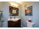 Cozy bathroom features vanity, patterned mirror and blue walls at 3259 Clairmont North Ne, Brookhaven, GA 30329