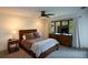 Cozy bedroom featuring a ceiling fan, TV, and a large window at 3259 Clairmont North Ne, Brookhaven, GA 30329