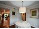 Bright breakfast nook adjacent to the kitchen and featuring hardwood floors and a modern light fixture at 3259 Clairmont North Ne, Brookhaven, GA 30329