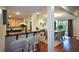 Dining area featuring stylish seating and a view of the modern kitchen and backyard at 3259 Clairmont North Ne, Brookhaven, GA 30329