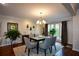 Inviting dining room boasts hardwood floors and large window at 3259 Clairmont North Ne, Brookhaven, GA 30329