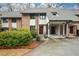 Charming townhome with brick facade, carport, and well-maintained landscaping at 3259 Clairmont North Ne, Brookhaven, GA 30329