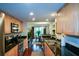 Modern kitchen featuring wood cabinets, granite countertops, stainless appliances, and hardwood floors at 3259 Clairmont North Ne, Brookhaven, GA 30329