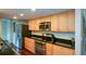 Well-lit kitchen features stainless steel appliances, wooden cabinets, and a dark countertop at 3259 Clairmont North Ne, Brookhaven, GA 30329