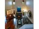 View of the living room with a fireplace, piano, and hardwood floors at 3259 Clairmont North Ne, Brookhaven, GA 30329