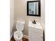 Powder room features a modern vanity, toilet and a framed mirror at 3991 Centennial Trl, Duluth, GA 30096