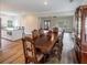 Formal dining room featuring a large wooden table and hardwood floors at 3991 Centennial Trl, Duluth, GA 30096