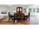Dining room with beautiful wood floors and a large antique cabinet at 3991 Centennial Trl, Duluth, GA 30096