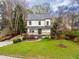 Charming two-story home with a well-manicured lawn and inviting front porch at 3991 Centennial Trl, Duluth, GA 30096