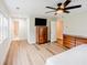 Spacious bedroom with hardwood floors, ensuite bath, and two windows at 3991 Centennial Trl, Duluth, GA 30096
