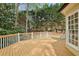View of the large wooden back deck overlooking a private and green backyard at 535 Telford Pl, Atlanta, GA 30342