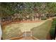Spacious backyard with trees for privacy, plus stairs leading up to a deck at 535 Telford Pl, Atlanta, GA 30342