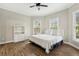 Bedroom with wood floors, neutral walls, and white trim, featuring lots of natural light at 535 Telford Pl, Atlanta, GA 30342