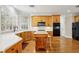 Bright kitchen with stainless steel appliances, an island with seating, lots of counter space and wood floors at 535 Telford Pl, Atlanta, GA 30342