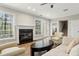 Bright living room with fireplace, wood floors, and lots of natural light at 535 Telford Pl, Atlanta, GA 30342