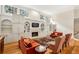 Well-lit living room with fireplace, built-in shelving and recessed lighting at 535 Telford Pl, Atlanta, GA 30342