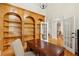 Spacious office with hardwood floors, built-in bookcase, and French doors at 535 Telford Pl, Atlanta, GA 30342