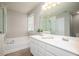 Bathroom featuring double sinks, a large mirror, and separate tub and shower at 246 Cavendar Way # 16, Marietta, GA 30066