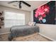 Bedroom featuring a cozy bed and unique wall art at 246 Cavendar Way # 16, Marietta, GA 30066