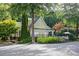 Community clubhouse with well-maintained lawn, lush greenery, and proximity to the pool offering residents recreation and relaxation at 246 Cavendar Way # 16, Marietta, GA 30066