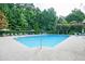 Large community pool features clear water and a deck with lounge chairs, surrounded by greenery for a resort-like experience at 246 Cavendar Way # 16, Marietta, GA 30066
