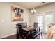 Cozy dining area features a dark wood table, bench, and a charming light fixture at 246 Cavendar Way # 16, Marietta, GA 30066