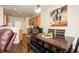 The dining area boasts an elegant dark wood table and a stylish light fixture at 246 Cavendar Way # 16, Marietta, GA 30066