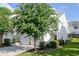 Home featuring a well-manicured lawn and mature landscaping in a peaceful setting at 246 Cavendar Way # 16, Marietta, GA 30066