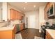 Functional kitchen features stainless steel appliances and wooden cabinets at 246 Cavendar Way # 16, Marietta, GA 30066