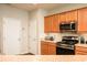 The kitchen has stainless steel appliances, wooden cabinets, and neutral countertops at 246 Cavendar Way # 16, Marietta, GA 30066