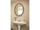 Stylish powder room with pedestal sink and decorative mirror at 246 Cavendar Way # 16, Marietta, GA 30066