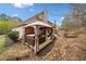 A backyard with a hot tub under a gazebo and a stone-lined path at 251 Manous Way, Canton, GA 30115