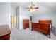 Open bedroom with neutral walls, carpet, and a ceiling fan at 251 Manous Way, Canton, GA 30115