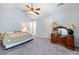 Large, bright bedroom with neutral walls, carpet, and an antique-style vanity at 251 Manous Way, Canton, GA 30115