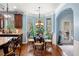 Bright dining area featuring hardwood floors and bay windows with outdoor views at 251 Manous Way, Canton, GA 30115