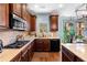 Granite counters and stainless appliances are featured in this kitchen at 251 Manous Way, Canton, GA 30115