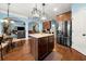 Open concept kitchen with granite island, stainless appliances, and seating at 251 Manous Way, Canton, GA 30115