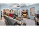 Comfortable living room with stone fireplace, ceiling fan, and views to kitchen at 251 Manous Way, Canton, GA 30115