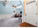 Cozy living room featuring high ceiling, large windows, and wall paneling at 251 Manous Way, Canton, GA 30115