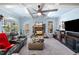 Comfortable living room featuring a cozy fireplace, high ceiling and large windows at 251 Manous Way, Canton, GA 30115