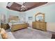 Spacious main bedroom featuring tray ceiling, ensuite bathroom, and lots of natural light at 251 Manous Way, Canton, GA 30115