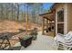 Outdoor patio with chairs, table, and a view of the backyard at 251 Manous Way, Canton, GA 30115