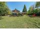 Spacious backyard featuring a lush lawn, patio area, and a charming outdoor living space for relaxation at 3530 Embry Cir, Atlanta, GA 30341