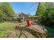 Landscaped backyard includes a patio and firepit, perfect for outdoor entertaining at 3530 Embry Cir, Atlanta, GA 30341