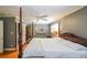 Comfortable primary suite boasts a four-poster bed, wood floors, seating area, and elegant decor at 3530 Embry Cir, Atlanta, GA 30341