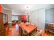 Dining room with hardwood floors, seating for six and open to other spaces at 3530 Embry Cir, Atlanta, GA 30341