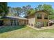 Charming two-story brick home featuring a well-manicured lawn and vibrant green trees at 3530 Embry Cir, Atlanta, GA 30341